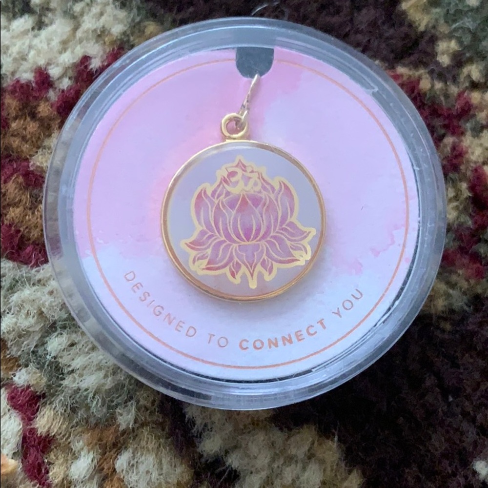 Alex and Ani charm.